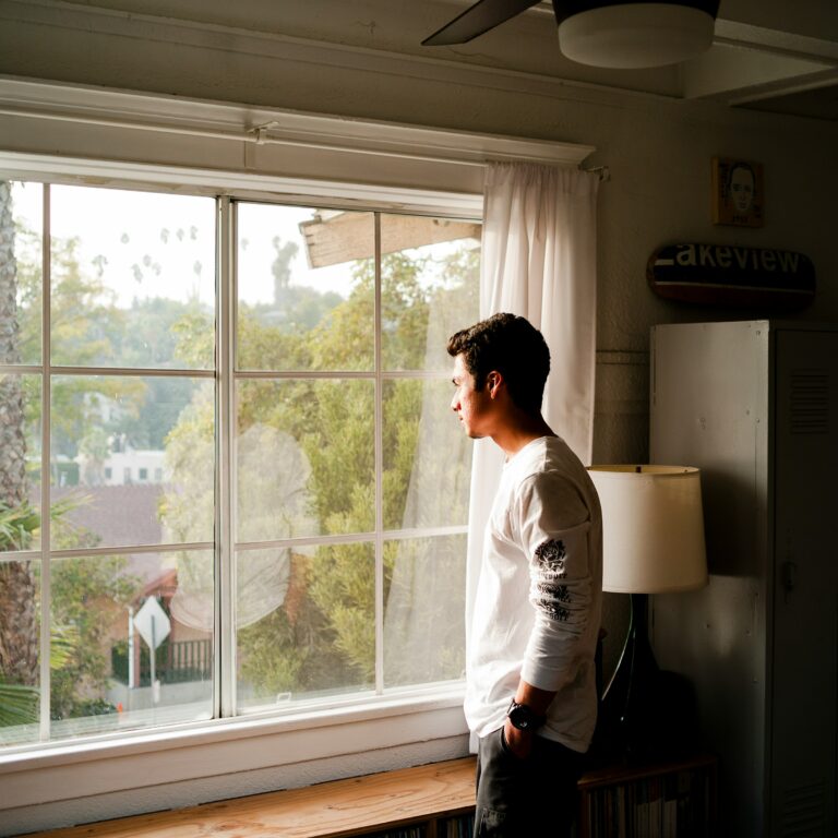 man-at-window-wondering-does-god-love-me